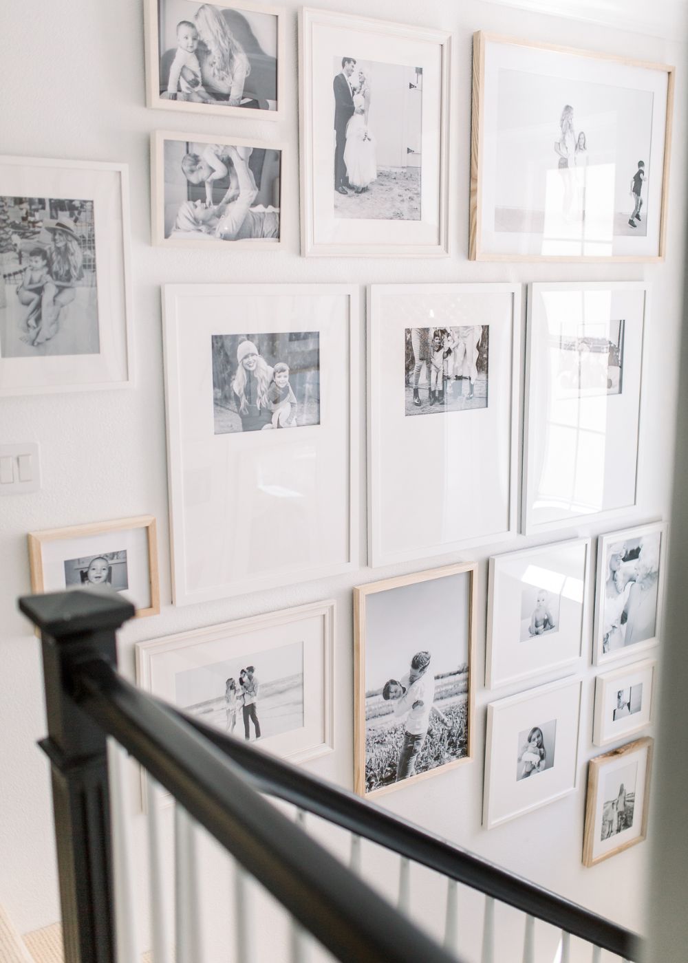 modern black and white photo gallery on a double story stairway