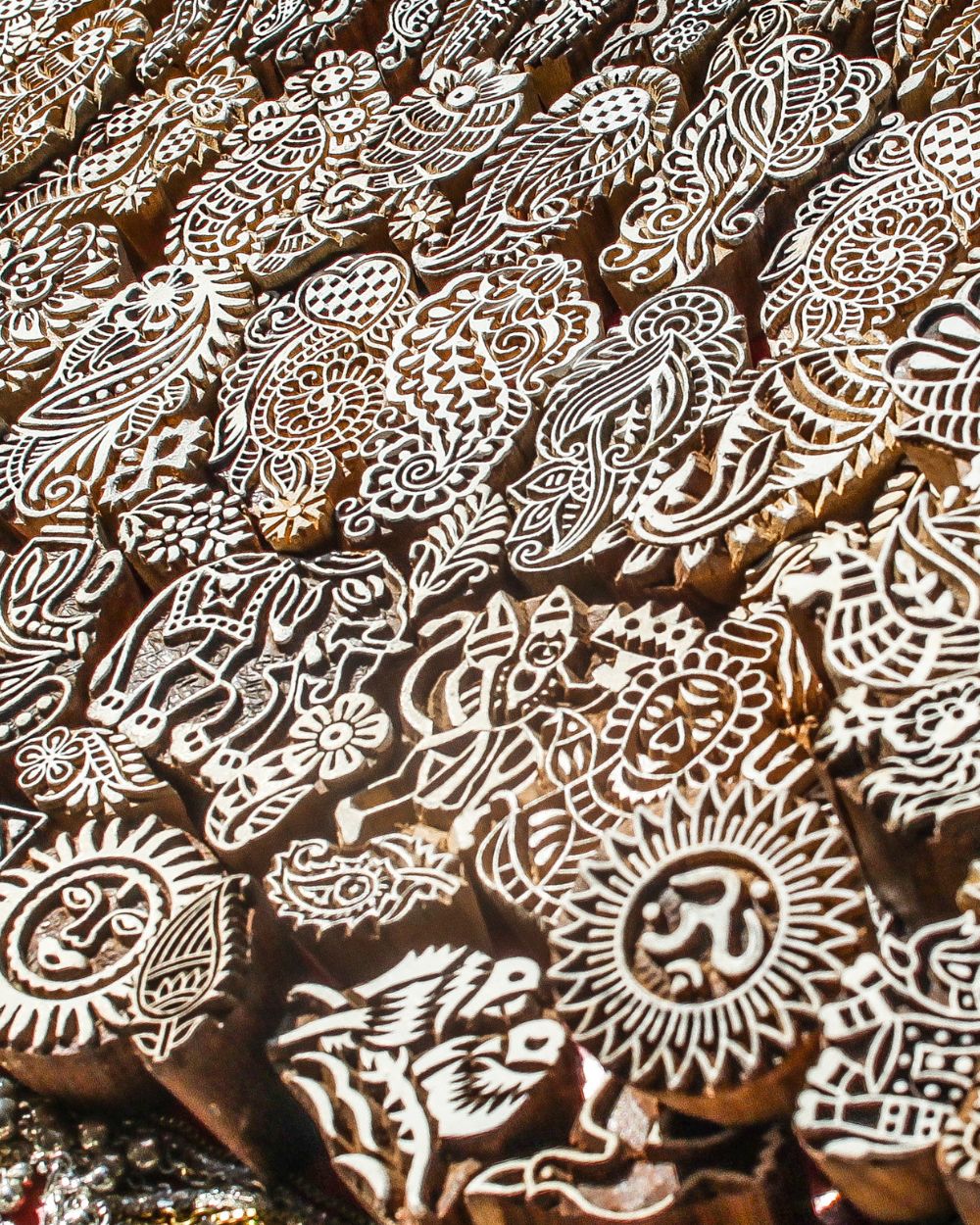 picture of dozens of hand carved wooden Indian block stamps