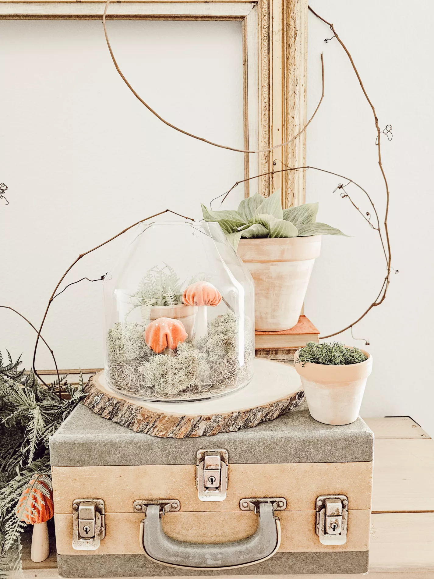 party space decor with moss, faux mushrooms, and nature